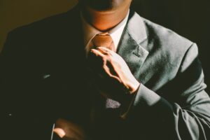 suited man attending armed forced covenant awards